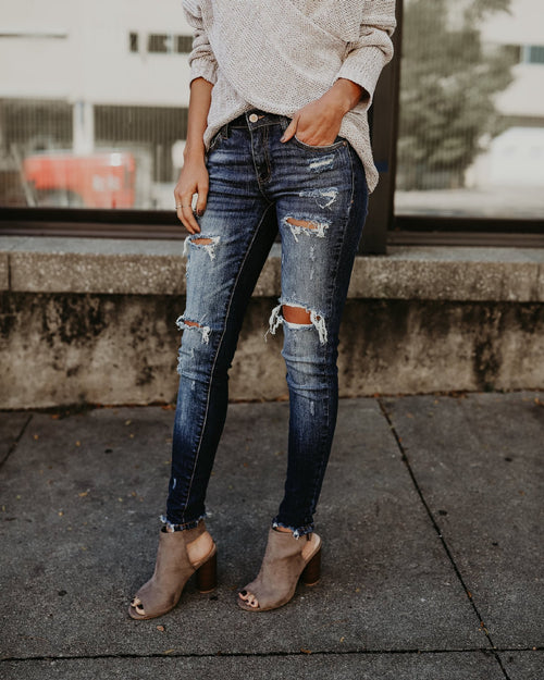 Jeans pitillo efecto roto y desgastado